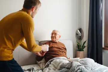 Caregiver helping an elderly person
